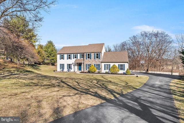 5 Craig Ln, Malvern, PA 19355 - colonial inspired home featuring a front yard and stucco siding