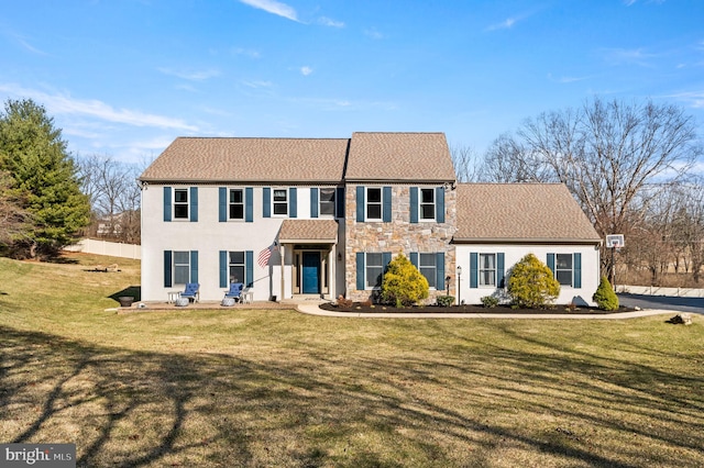 5 Craig Ln, Malvern, PA 19355 - view of front of house with stone siding, a front yard, and stucco siding