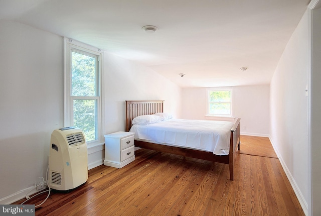 2530 18th St N, Arlington, VA 22201 - bedroom with light wood-style floors, vaulted ceiling, and baseboards