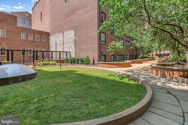 631 D St NW Unit 431, Washington, DC 20004 - view of community with a lawn