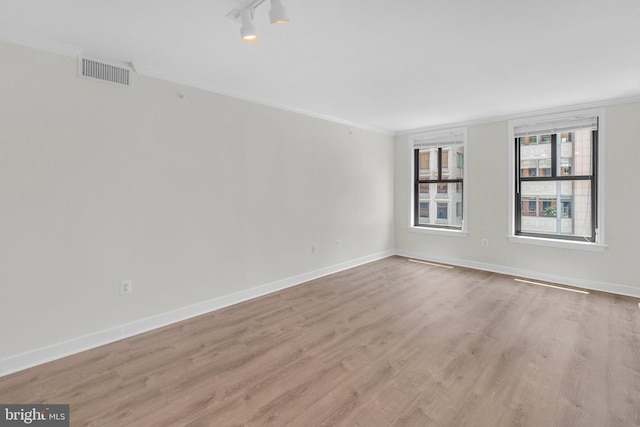 631 D St NW Unit 431, Washington, DC 20004 - unfurnished room with light wood-style flooring, ornamental molding, and baseboards