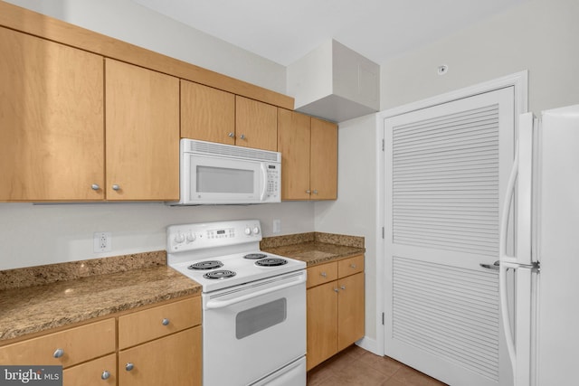 631 D St NW Unit 431, Washington, DC 20004 - kitchen with white appliances and light tile patterned floors