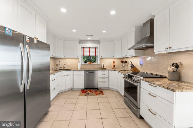 105 Bayview Ln, Hague, VA 22469 - kitchen with stainless steel appliances, wall chimney range hood, a sink, white cabinets, and recessed lighting