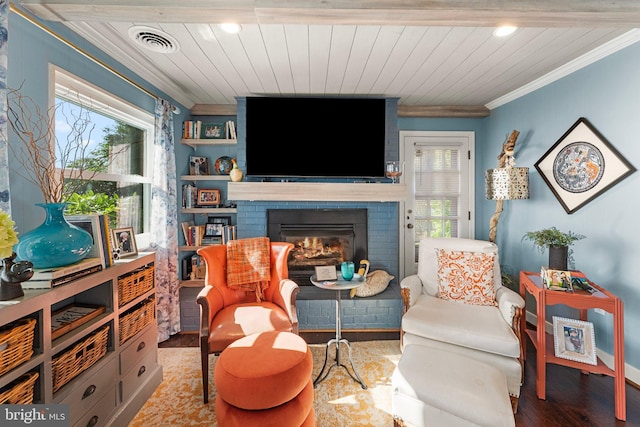 105 Bayview Ln, Hague, VA 22469 - living area with ornamental molding, a fireplace, healthy amount of natural light, wood finished floors, and wooden ceiling