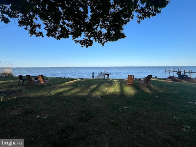 105 Bayview Ln, Hague, VA 22469 - view of green lawn with a water view and a dock