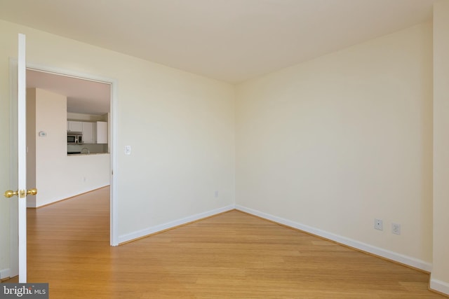 100 Harborview Dr Unit 513, Baltimore, MD 21230 - unfurnished room featuring light wood-style floors and baseboards