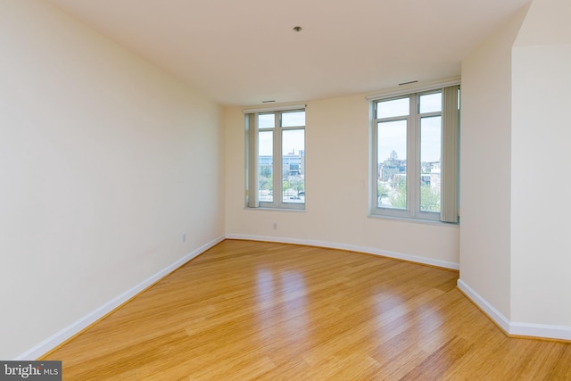 100 Harborview Dr Unit 513, Baltimore, MD 21230 - spare room with light wood finished floors, healthy amount of natural light, and baseboards