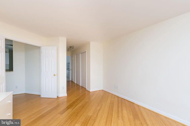 100 Harborview Dr Unit 513, Baltimore, MD 21230 - spare room with light wood-style floors and baseboards