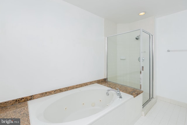 100 Harborview Dr Unit 513, Baltimore, MD 21230 - bathroom with a shower stall, a whirlpool tub, and tile patterned flooring