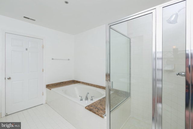 100 Harborview Dr Unit 513, Baltimore, MD 21230 - full bathroom with a stall shower, a bath, and tile patterned floors