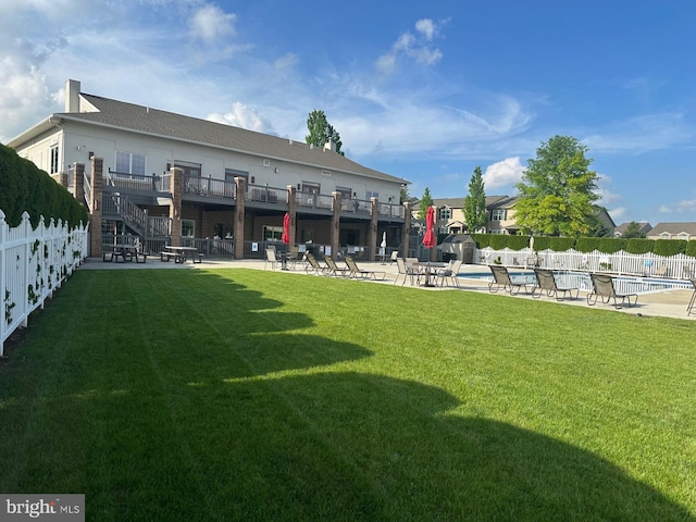 261 Osprey Ln, Hummelstown, PA 17036 - back of property featuring a community pool and a patio area