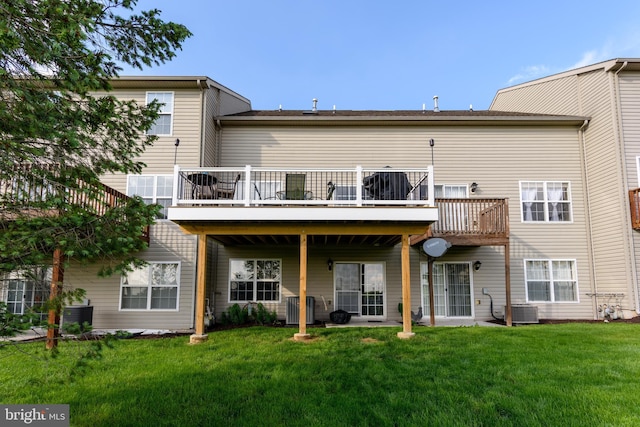261 Osprey Ln, Hummelstown, PA 17036 - rear view of house featuring central air condition unit, a yard, and a wooden deck
