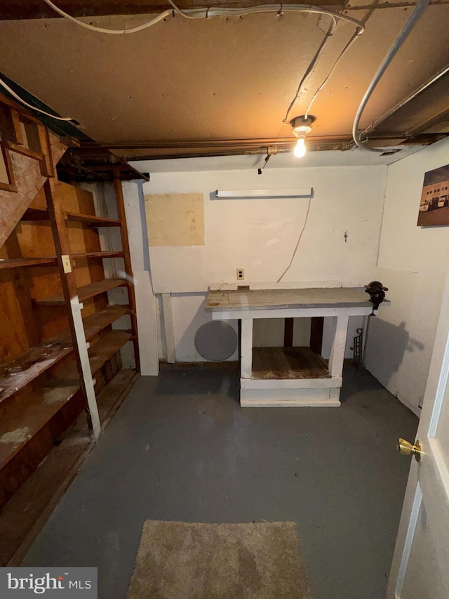basement with a workshop area
