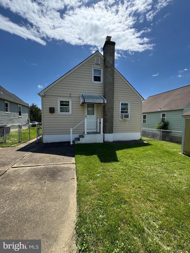 rear view of property with a chimney