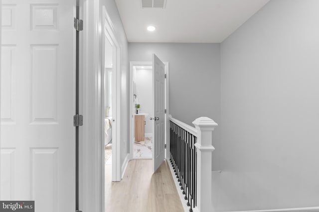 1505 N Pulaski St, Baltimore, MD 21217 - corridor with an upstairs landing, light wood finished floors, and recessed lighting