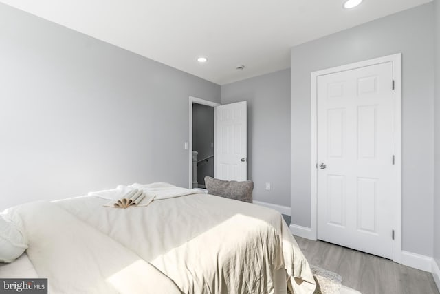 1505 N Pulaski St, Baltimore, MD 21217 - bedroom with light wood-type flooring, baseboards, and recessed lighting