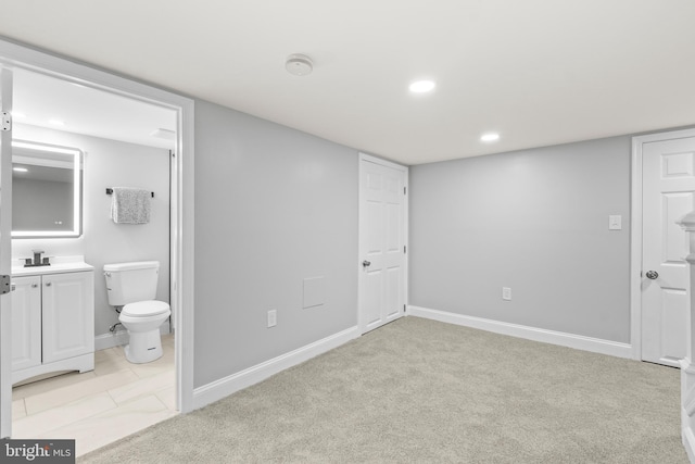 1505 N Pulaski St, Baltimore, MD 21217 - unfurnished bedroom featuring recessed lighting, ensuite bath, baseboards, and light colored carpet