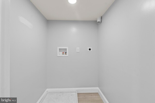 1505 N Pulaski St, Baltimore, MD 21217 - laundry room with hookup for an electric dryer, hookup for a washing machine, baseboards, and light wood-style flooring