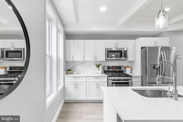 1505 N Pulaski St, Baltimore, MD 21217 - kitchen with stainless steel appliances, ornamental molding, white cabinets, backsplash, and recessed lighting
