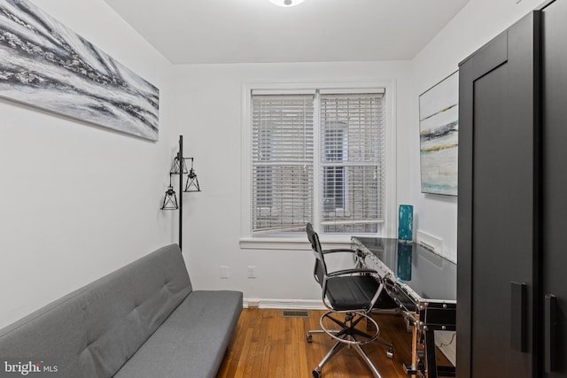 office with wood finished floors, healthy amount of natural light, and baseboards