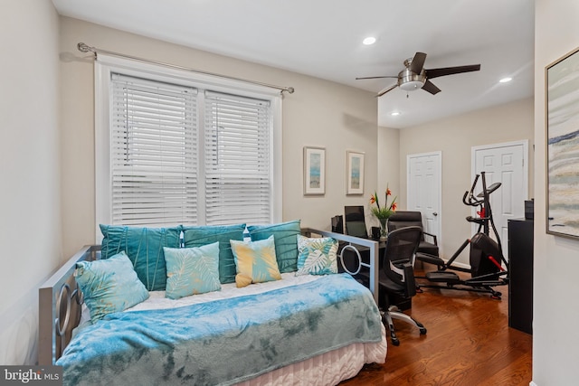 bedroom with wood finished floors, recessed lighting, and a ceiling fan