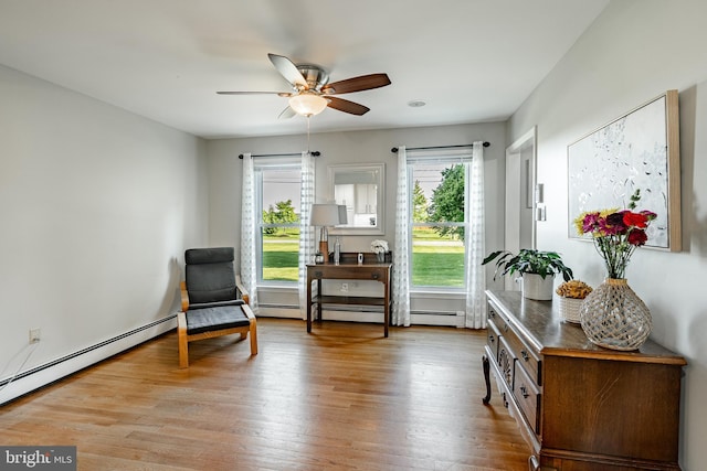 40 Hunters Run Rd, Honey Brook, PA 19344 - living area with a ceiling fan, wood finished floors, and a baseboard heating unit
