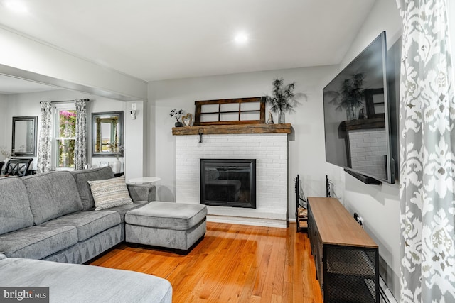 40 Hunters Run Rd, Honey Brook, PA 19344 - living room featuring a brick fireplace and light wood finished floors