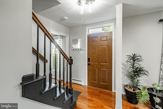 40 Hunters Run Rd, Honey Brook, PA 19344 - foyer featuring a baseboard heating unit, stairway, and light wood-style flooring