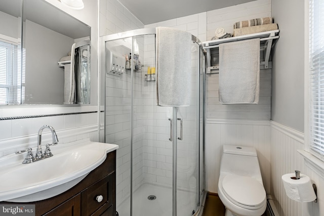 40 Hunters Run Rd, Honey Brook, PA 19344 - full bath featuring plenty of natural light, a shower stall, vanity, toilet, and a wainscoted wall