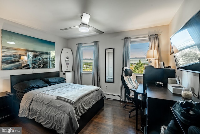 40 Hunters Run Rd, Honey Brook, PA 19344 - bedroom featuring baseboard heating, a desk, dark wood-style flooring, and a ceiling fan