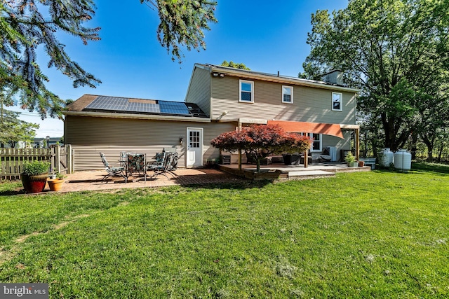 40 Hunters Run Rd, Honey Brook, PA 19344 - back of house featuring solar panels and a patio