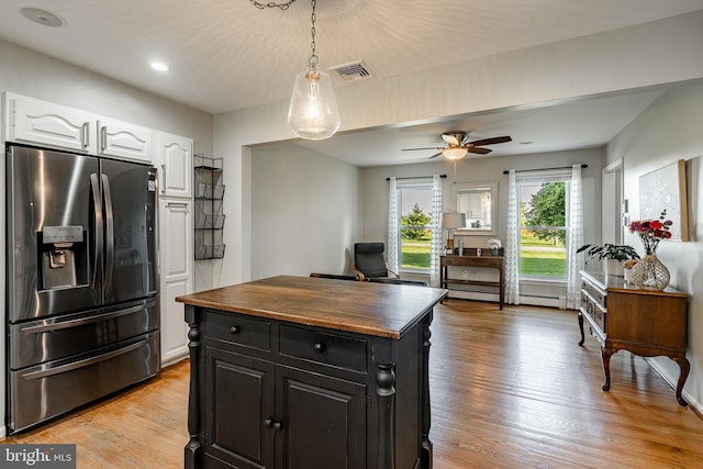 40 Hunters Run Rd, Honey Brook, PA 19344 - kitchen with stainless steel refrigerator with ice dispenser, wood counters, white cabinetry, dark cabinetry, and light wood-style floors