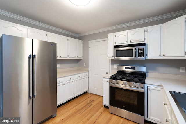 306 Canyon Rd, Winchester, VA 22602 - kitchen featuring stainless steel appliances, white cabinetry, crown molding, and light wood-style floors