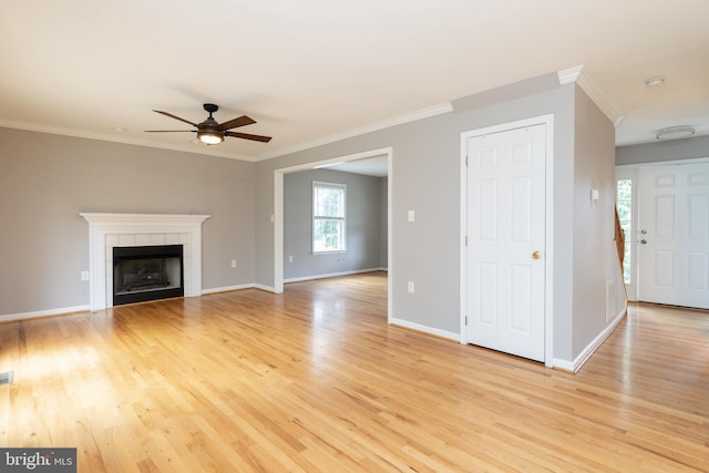 306 Canyon Rd, Winchester, VA 22602 - unfurnished living room featuring crown molding, light wood finished floors, a ceiling fan, baseboards, and a fireplace