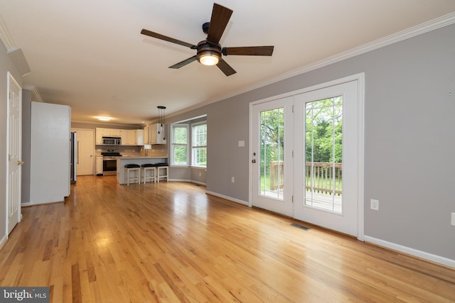 306 Canyon Rd, Winchester, VA 22602 - unfurnished living room featuring ornamental molding, light wood-style flooring, a ceiling fan, and baseboards