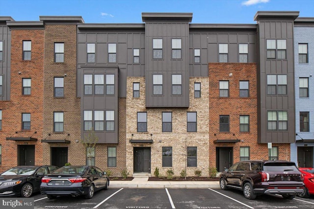 view of property featuring uncovered parking