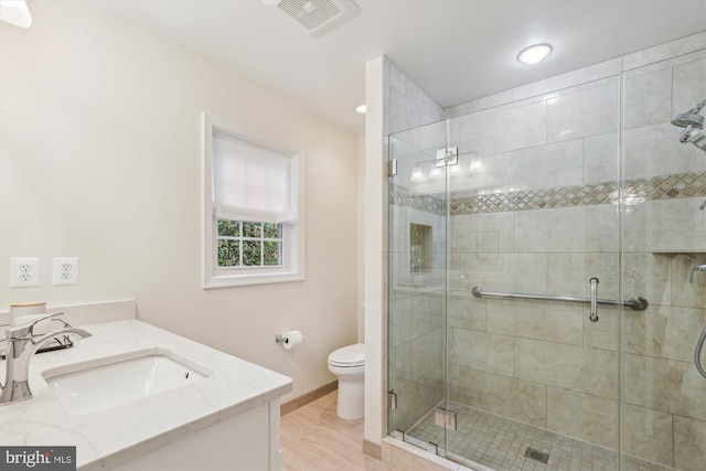2032 Franklin Cluster Ct, Falls Church, VA 22043 - bathroom with toilet, vanity, a shower stall, and baseboards