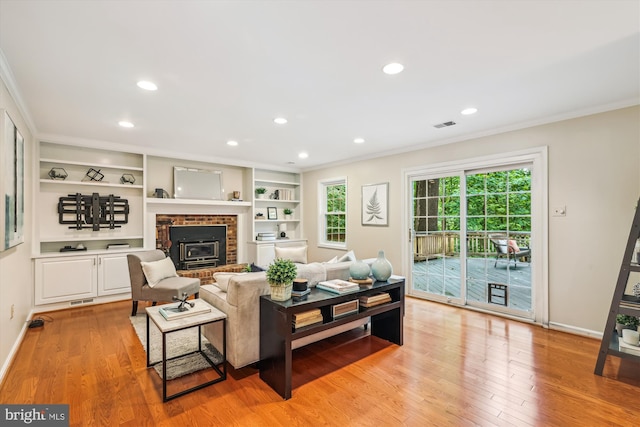 2032 Franklin Cluster Ct, Falls Church, VA 22043 - living room with ornamental molding, light wood-type flooring, recessed lighting, baseboards, and a brick fireplace