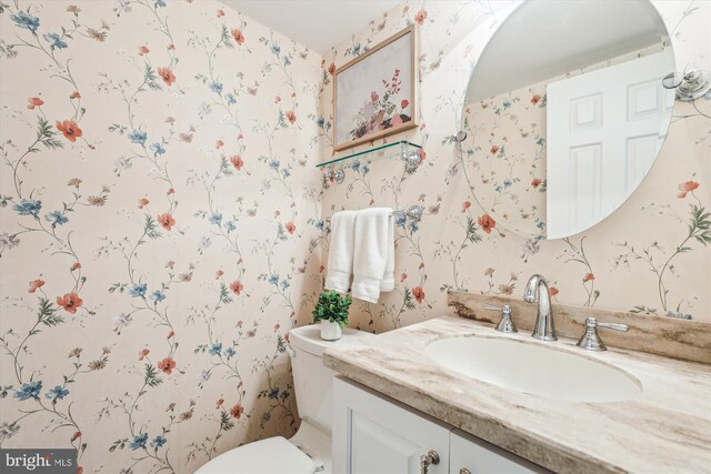 2032 Franklin Cluster Ct, Falls Church, VA 22043 - half bathroom with wallpapered walls, vanity, and toilet