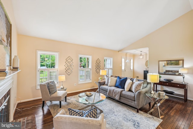 2032 Franklin Cluster Ct, Falls Church, VA 22043 - living area featuring dark wood finished floors, a tiled fireplace, baseboards, and lofted ceiling