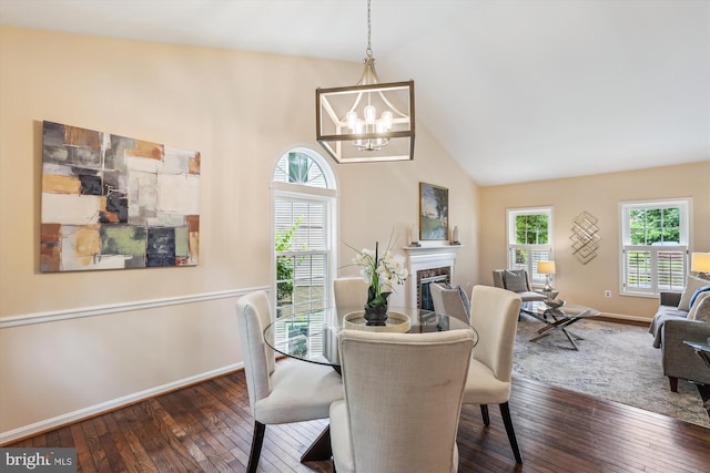 2032 Franklin Cluster Ct, Falls Church, VA 22043 - dining area featuring dark wood-style floors, a chandelier, a fireplace, baseboards, and high vaulted ceiling