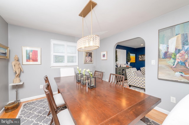 1909 Bloomingdale Ave, Lancaster, PA 17601 - dining space with wood finished floors, arched walkways, and baseboards