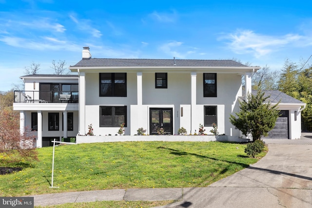 2100 S Pierce St, Arlington, VA 22202 - neoclassical home with stucco siding, a chimney, driveway, and a front yard