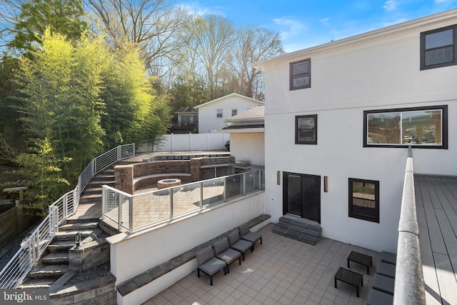 2100 S Pierce St, Arlington, VA 22202 - rear view of house with stucco siding, fence, entry steps, and a deck