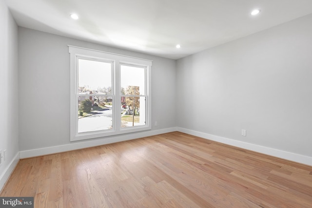 2100 S Pierce St, Arlington, VA 22202 - empty room featuring baseboards, light wood finished floors, and recessed lighting
