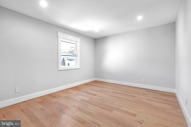 2100 S Pierce St, Arlington, VA 22202 - empty room featuring light wood finished floors, baseboards, and recessed lighting