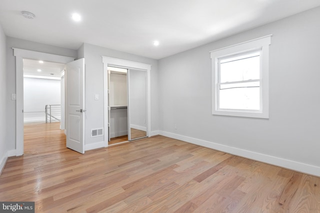 2100 S Pierce St, Arlington, VA 22202 - unfurnished bedroom featuring light wood-style flooring, baseboards, recessed lighting, and a closet