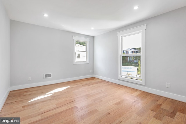2100 S Pierce St, Arlington, VA 22202 - empty room with wood finished floors, baseboards, and recessed lighting