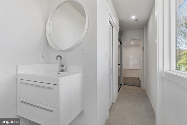 2100 S Pierce St, Arlington, VA 22202 - bathroom with vanity, tile patterned floors, and recessed lighting