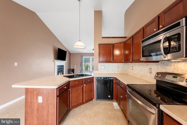 81 Toulouse Ln, Martinsburg, WV 25403 - kitchen with appliances with stainless steel finishes, vaulted ceiling, light countertops, a sink, and decorative backsplash